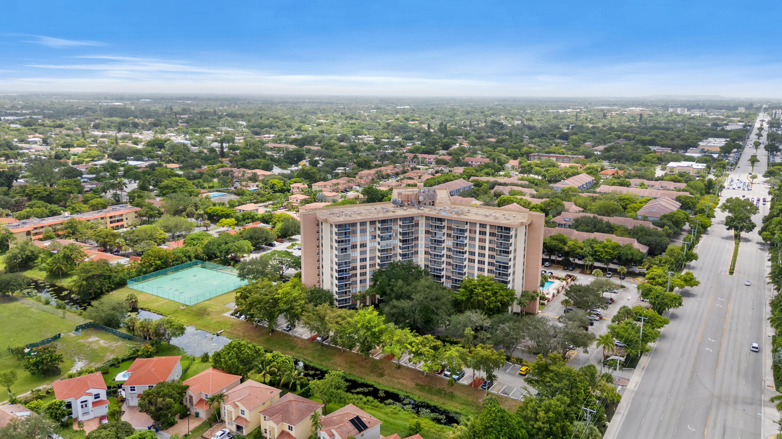10777 West Sample Road, Unit 508 Coral Springs, FL 33065 - Photo 17 of 25 a view of a city with tall buildings