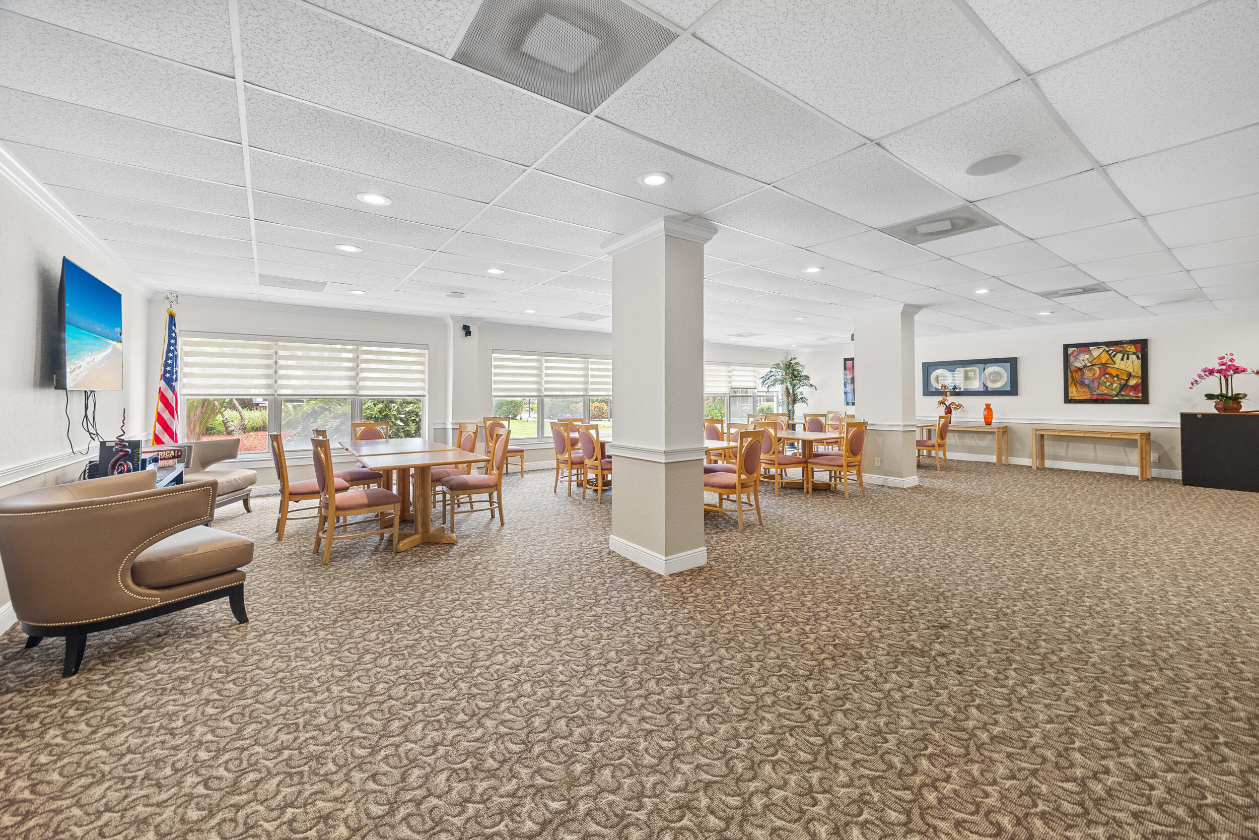 10777 West Sample Road, Unit 508 Coral Springs, FL 33065 - Photo 7 of 25 a living room with furniture and a large window