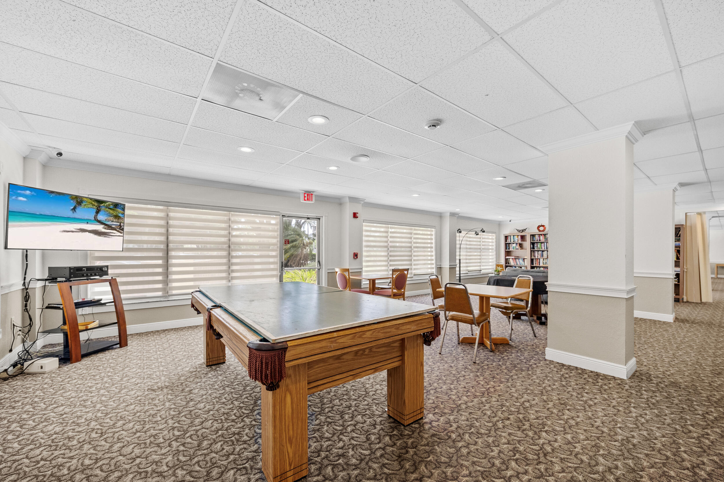 10777 West Sample Road, Unit 508 Coral Springs, FL 33065 - Photo 8 of 25 a room with furniture pool table and windows