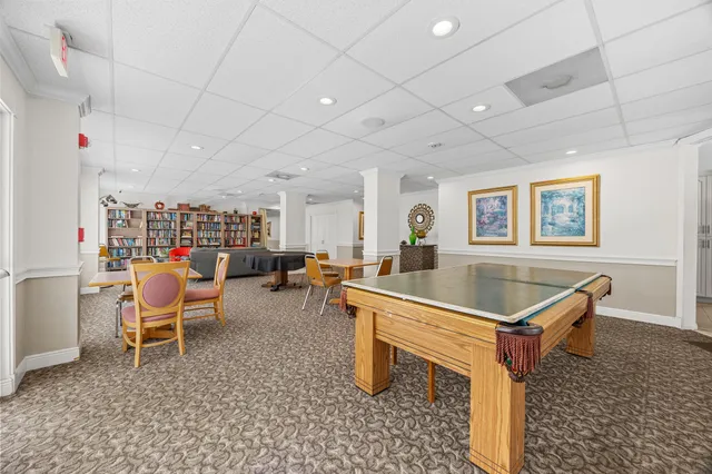 a room with furniture and air hockey table
