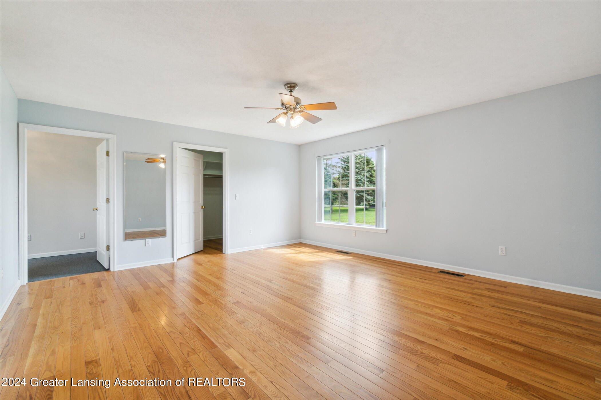 12550 Watson Road Bath, MI 48808 - Photo 15 of 76 Main Floor Primary Bedroom