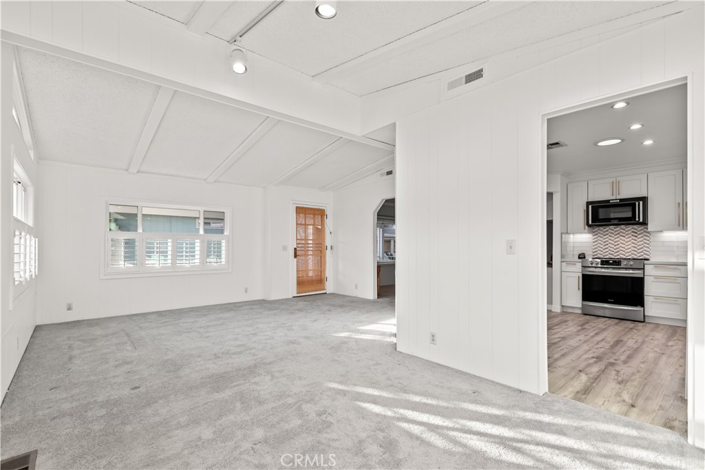 5200 Irvine Boulevard Irvine, CA 92620 - Photo 13 of 52 an empty room with a kitchen and a sink
