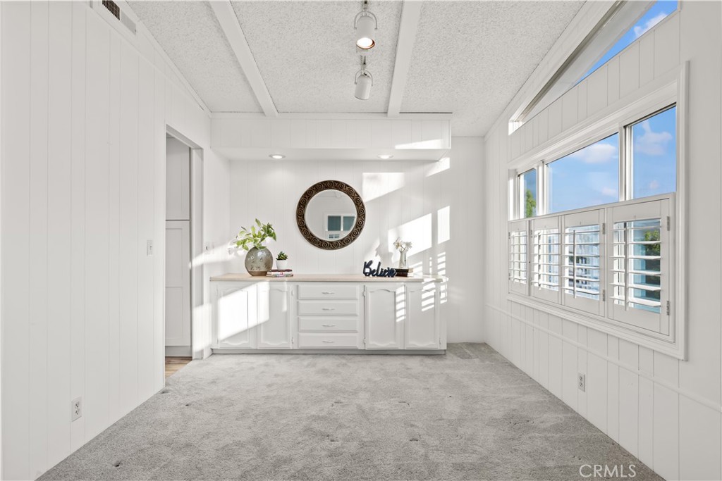 5200 Irvine Boulevard Irvine, CA 92620 - Photo 14 of 52 a view of a hallway with washer and dryer