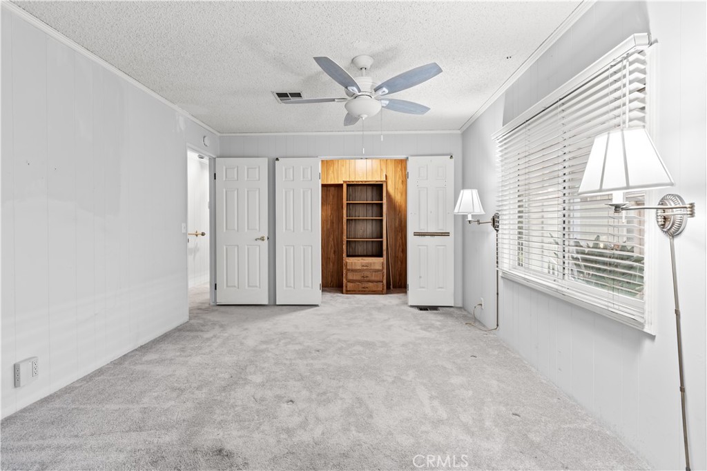 5200 Irvine Boulevard Irvine, CA 92620 - Photo 18 of 52 an empty room with windows and a ceiling fan