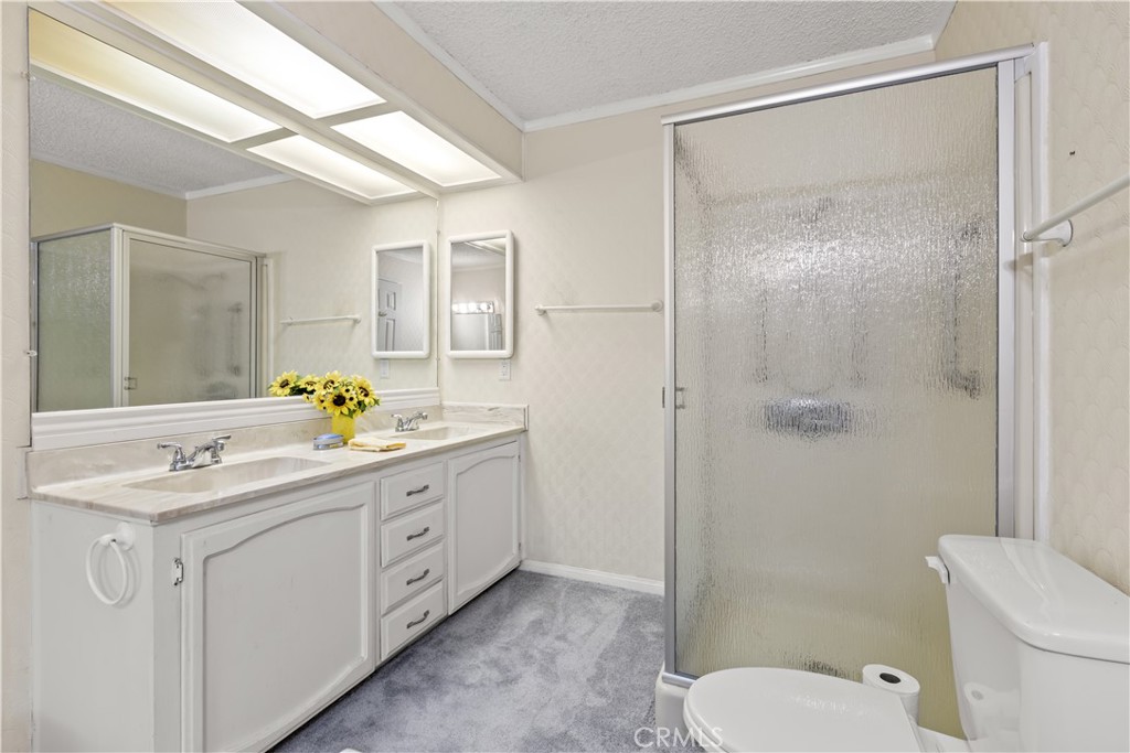 5200 Irvine Boulevard Irvine, CA 92620 - Photo 20 of 52 a spacious bathroom with a granite countertop sink mirror and toilet