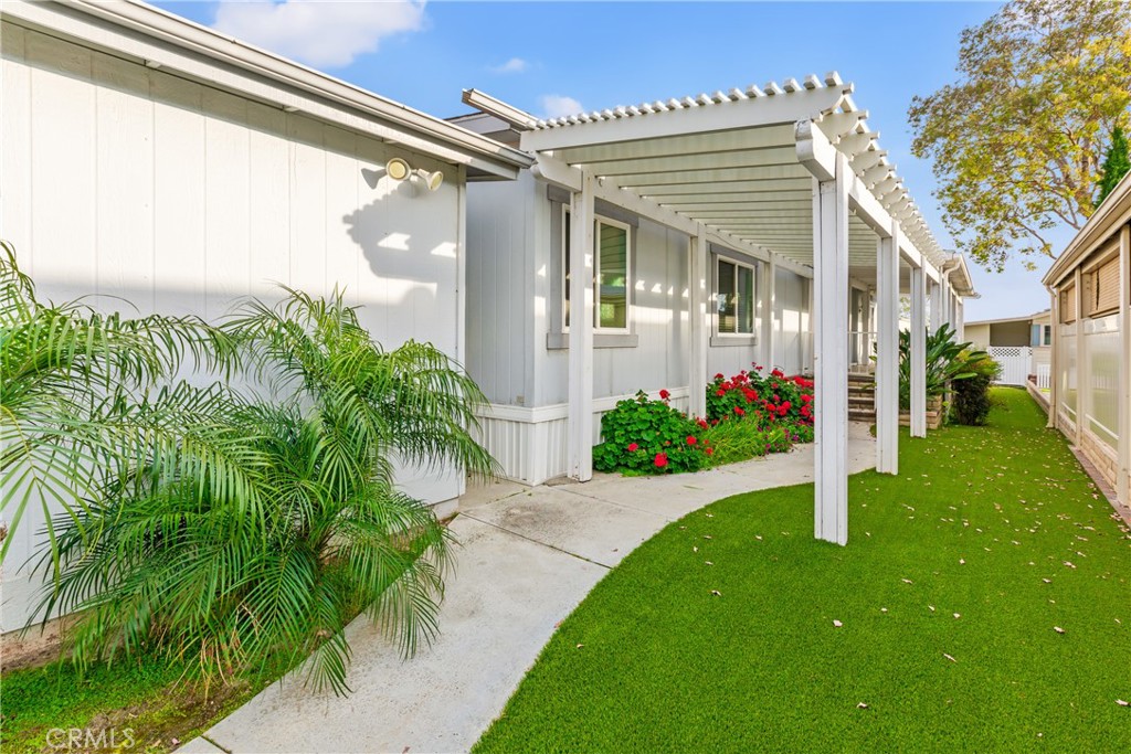 5200 Irvine Boulevard Irvine, CA 92620 - Photo 2 of 52 a front view of a house with a porch