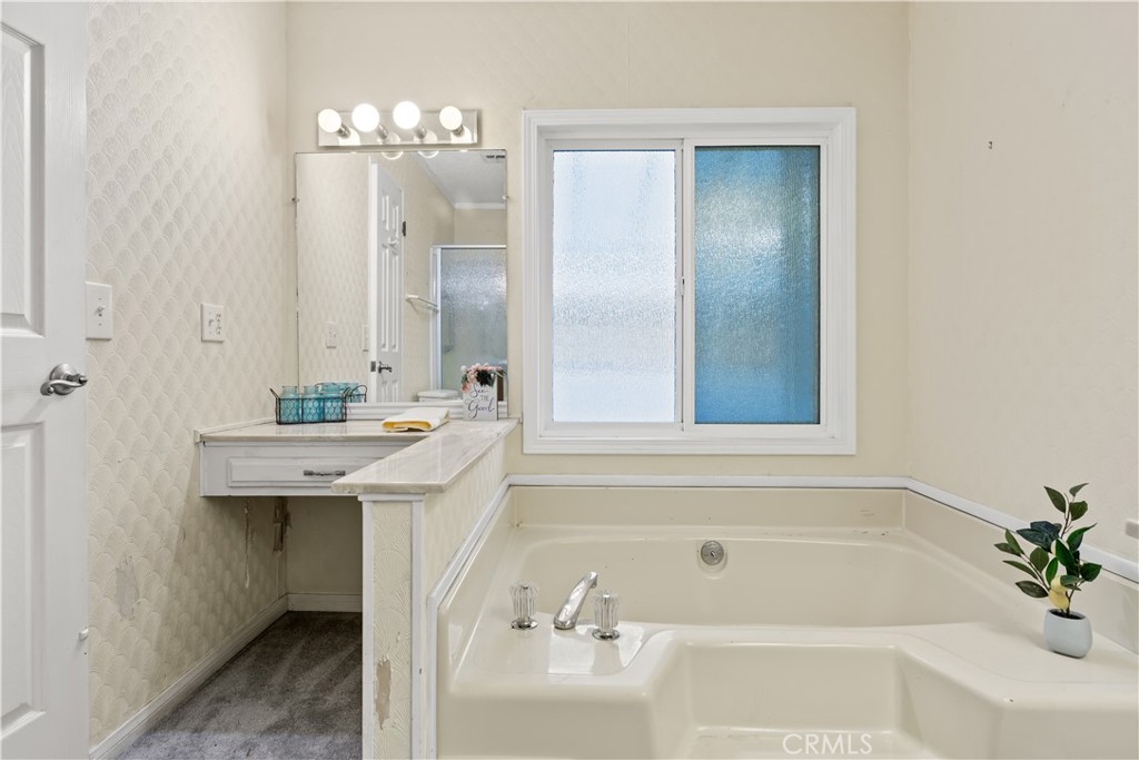 5200 Irvine Boulevard Irvine, CA 92620 - Photo 21 of 52 a bathroom with a bathtub and a sink