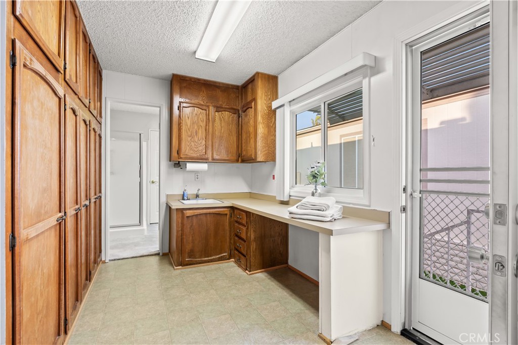 5200 Irvine Boulevard Irvine, CA 92620 - Photo 26 of 52 a kitchen with stainless steel appliances granite countertop a stove and a refrigerator