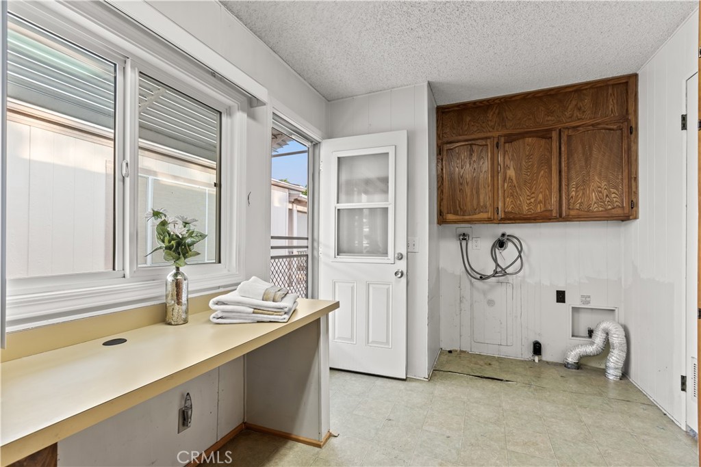 5200 Irvine Boulevard Irvine, CA 92620 - Photo 27 of 52 a bathroom with a granite countertop sink and a mirror