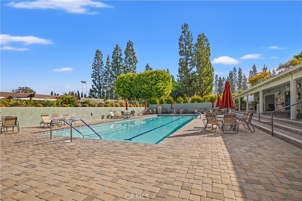 5200 Irvine Boulevard Irvine, CA 92620 - Photo 34 of 52 a view of a swimming pool with a patio