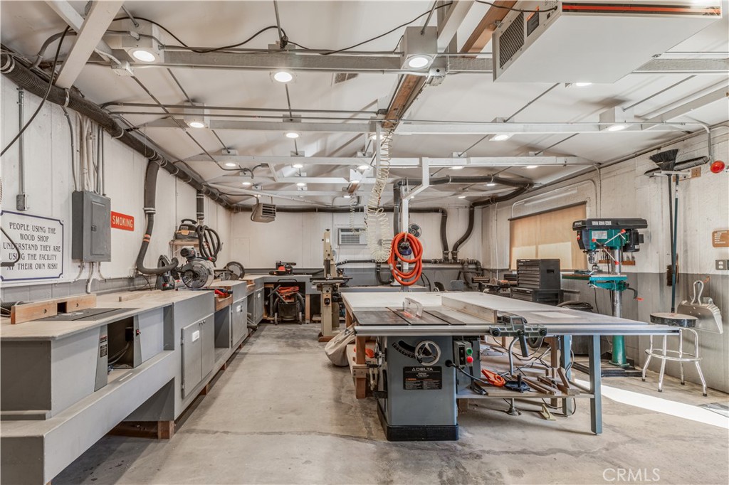 5200 Irvine Boulevard Irvine, CA 92620 - Photo 40 of 52 a view of a kitchen with appliances wooden floor and a counter top space