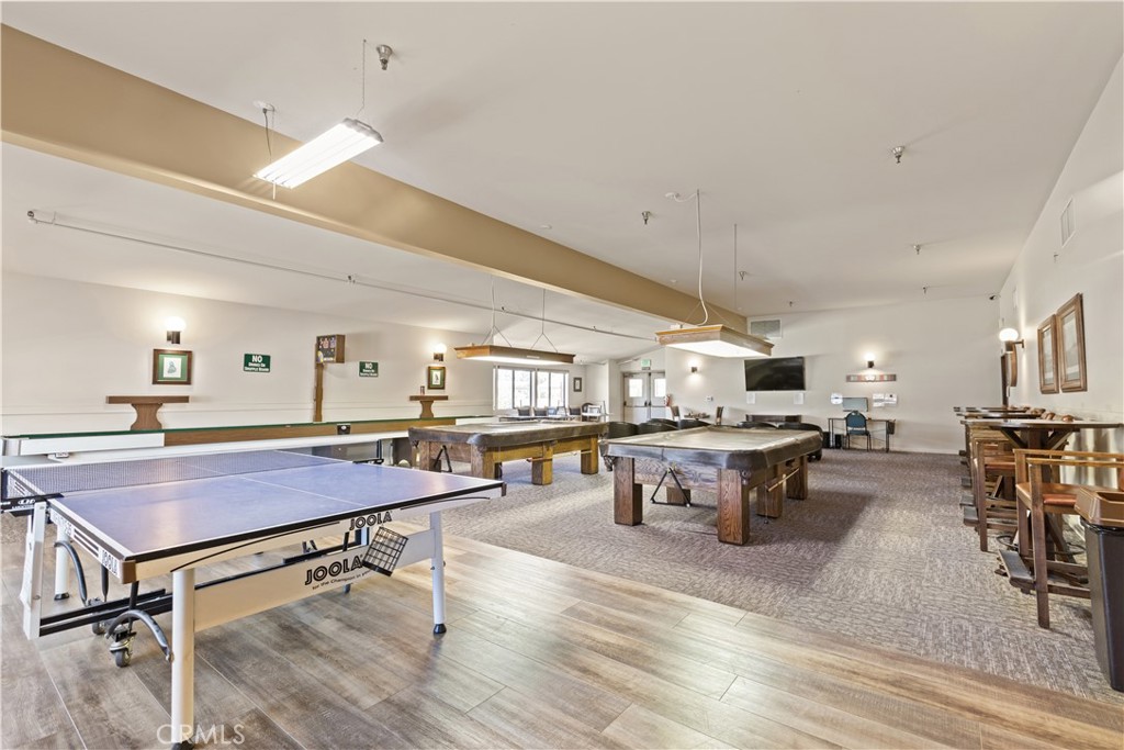 5200 Irvine Boulevard Irvine, CA 92620 - Photo 44 of 52 a living room with furniture a dining table and wooden floor
