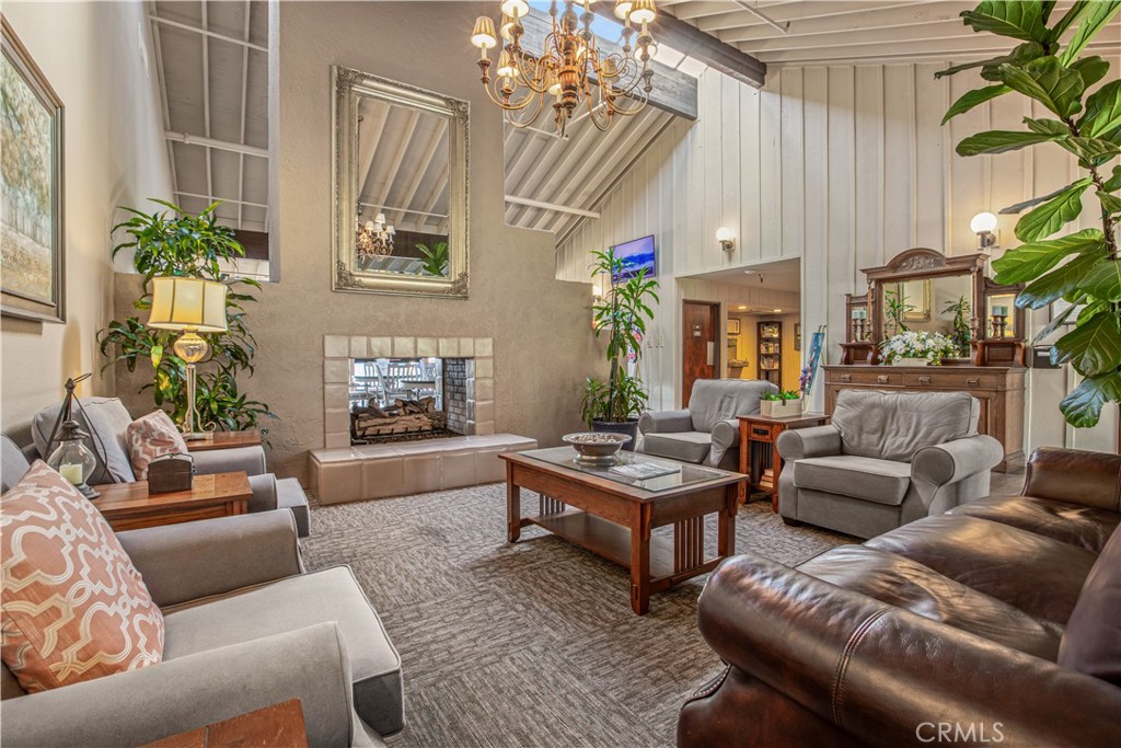 5200 Irvine Boulevard Irvine, CA 92620 - Photo 50 of 52 a living room with furniture flower pot and a fireplace