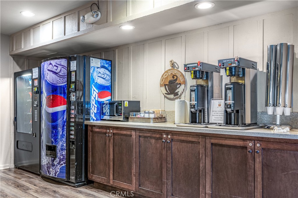 5200 Irvine Boulevard Irvine, CA 92620 - Photo 51 of 52 a kitchen with stainless steel appliances granite countertop a refrigerator and a stove