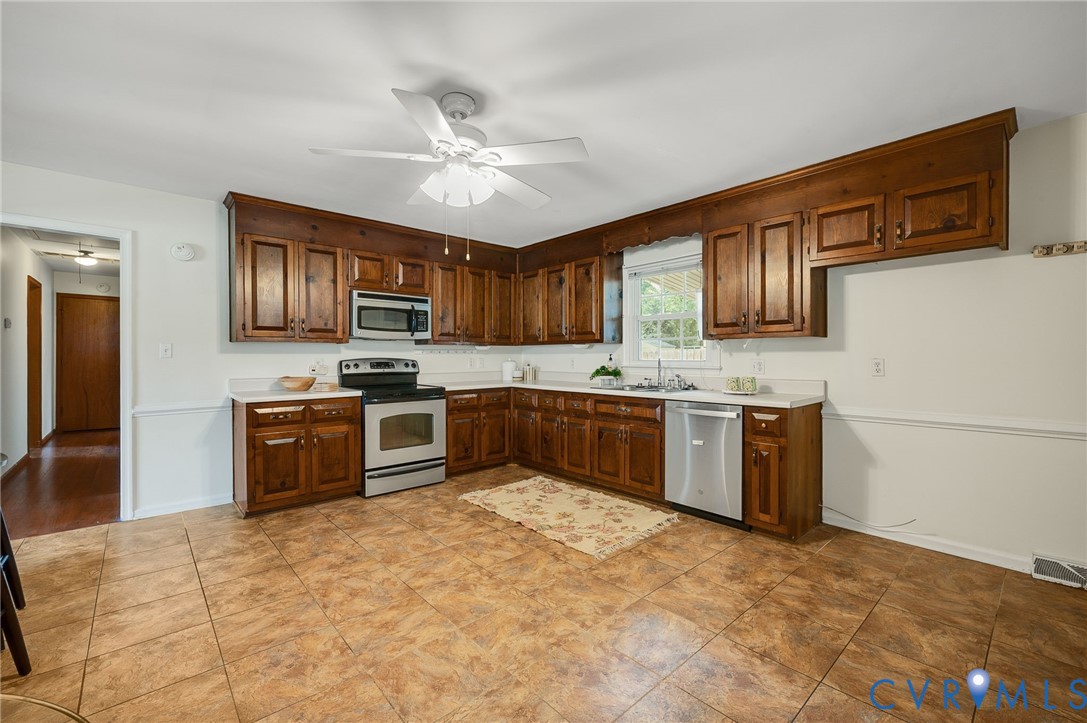 25205 Ritchie Avenue Petersburg, VA 23803 - Photo 9 of 30 Kitchen featuring wood cabinetry, stainless steel