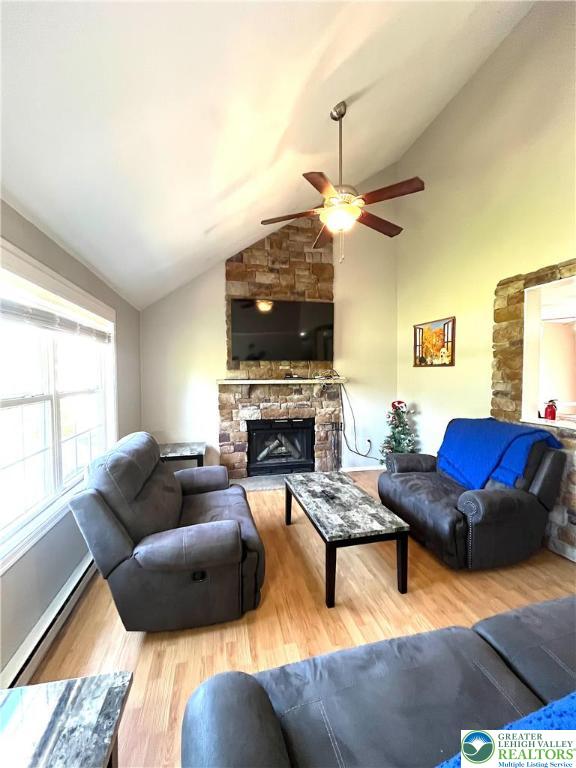 1646 Clover Road Long Pond, PA 18334 - Photo 5 of 20 a living room with furniture a fireplace and a flat screen tv