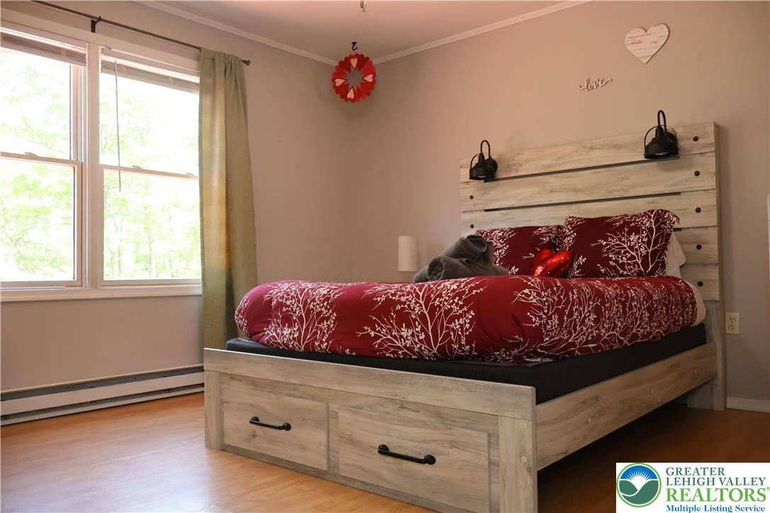1646 Clover Road Long Pond, PA 18334 - Photo 10 of 20 a bed room with a bed and a window