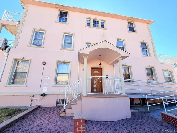 a view of a patio with table and chairs