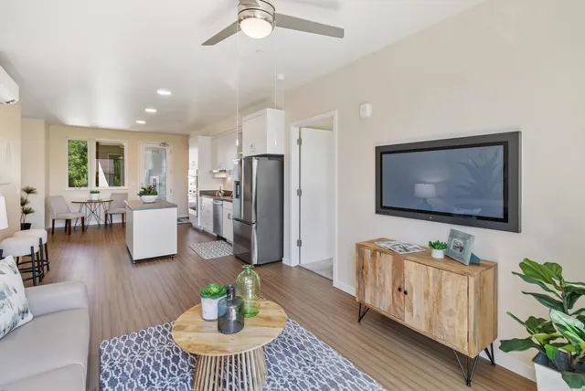 a living room with furniture and a flat screen tv
