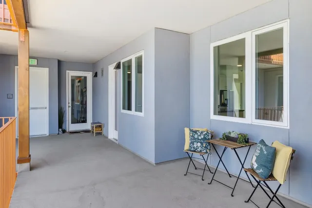 a view of room with furniture and windows
