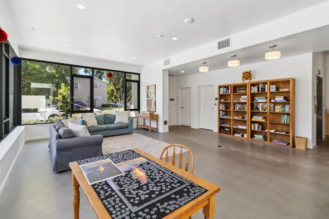 a living room with furniture and a rug