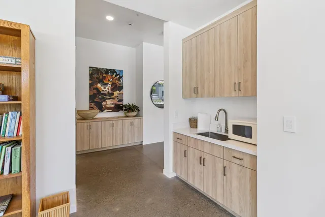a kitchen with stainless steel appliances a sink and cabinets