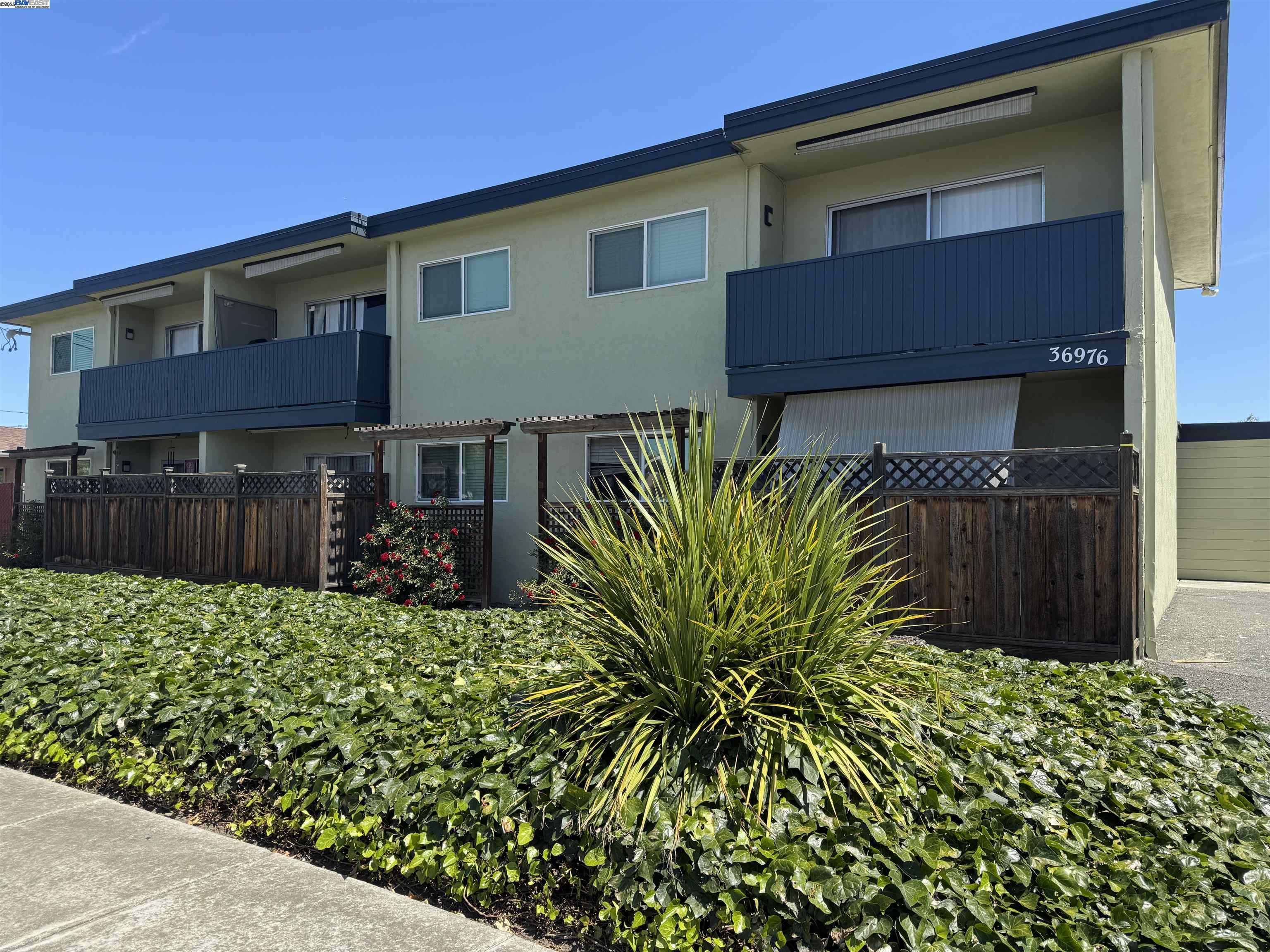 a view of a house with a flower garden