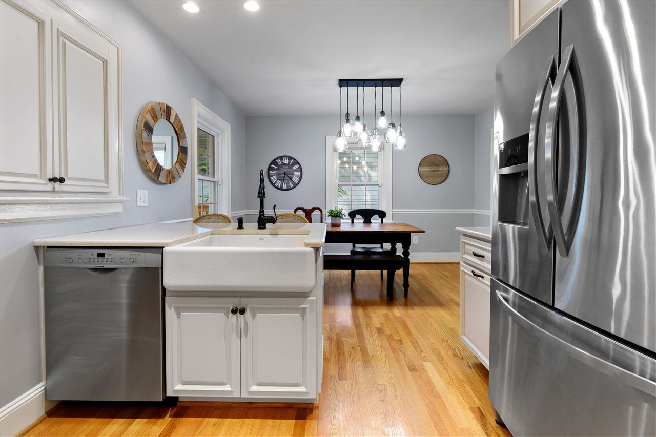 2618 Van Dyke Avenue Raleigh, NC 27607 - Photo 7 of 30 New kitchen in 2018 added an island, new sink, new Stainless Steel appliances, quartz countertops and a gas range with range hood! Kitchen