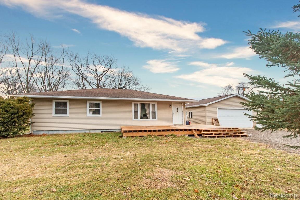 2890 Fleming Road Howell, MI 48855 - Photo 1 of 25 Large deck overlooking the beautiful front yard
