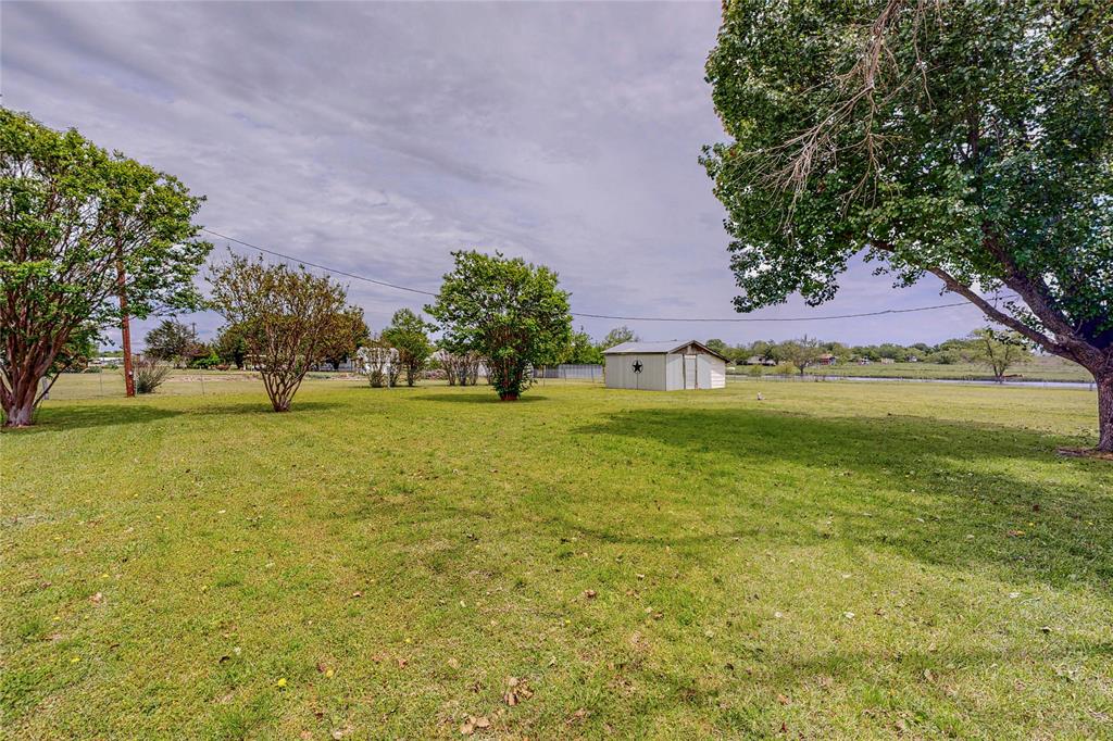1501 Joyce Road Kaufman, TX 75142 - Photo 12 of 37 a garden with trees in the background