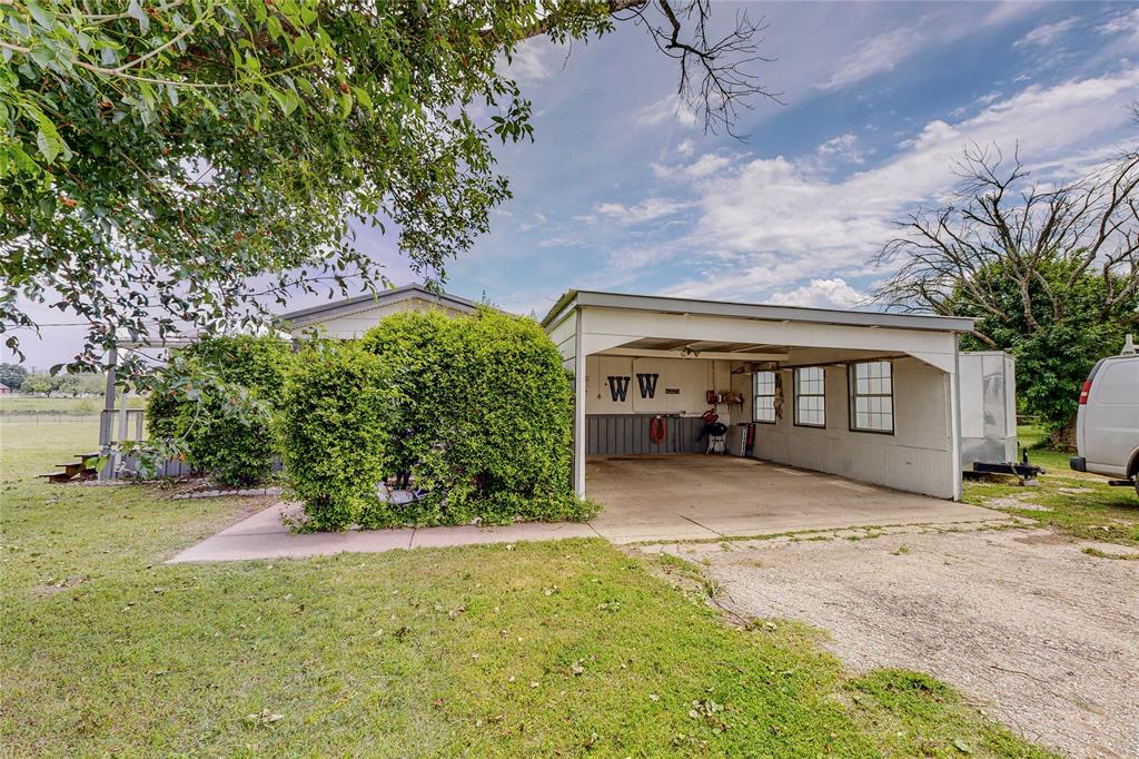 1501 Joyce Road Kaufman, TX 75142 - Photo 3 of 37 a front view of a house with a yard