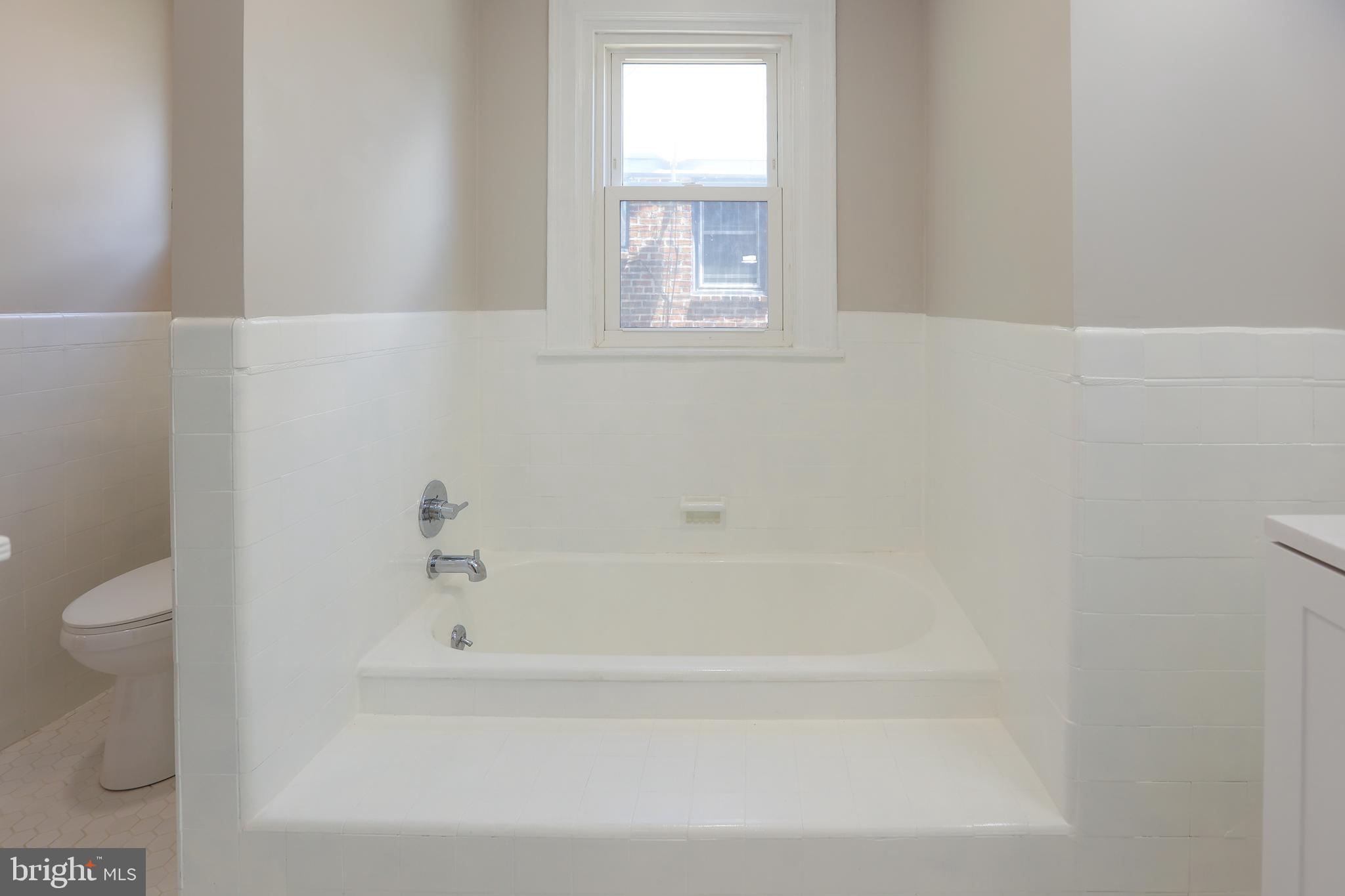 12 East Providence Road Lansdowne, PA 19050 - Photo 14 of 30 a bathroom with a bathtub and a toilet