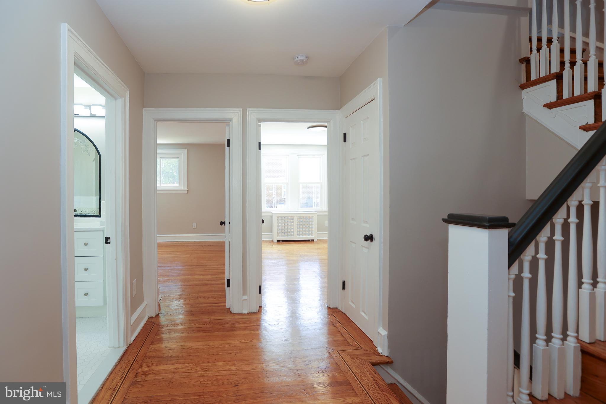 12 East Providence Road Lansdowne, PA 19050 - Photo 17 of 30 a view of a hallway with wooden floor and staircase