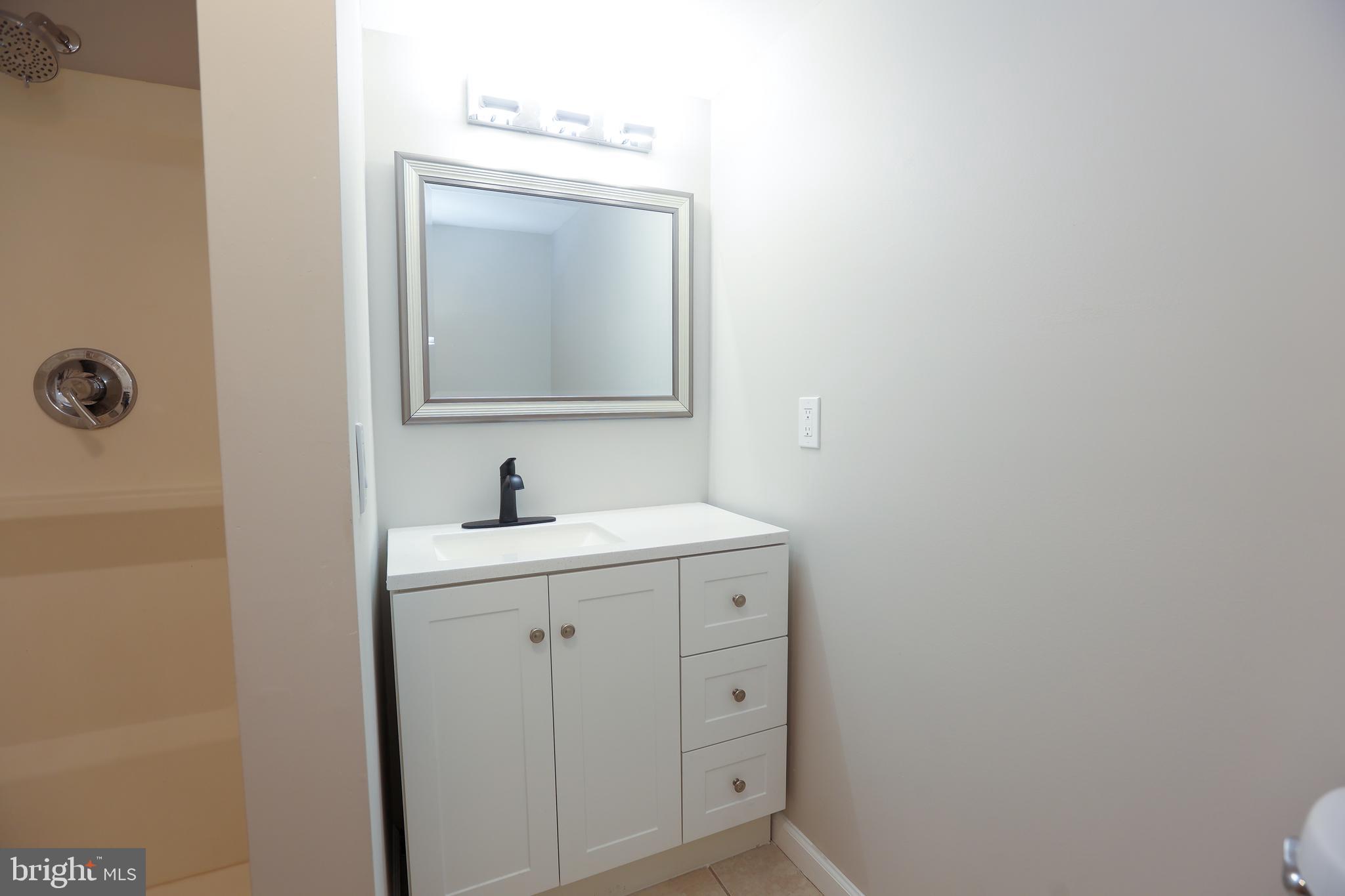 12 East Providence Road Lansdowne, PA 19050 - Photo 24 of 30 a bathroom with a toilet sink and mirror