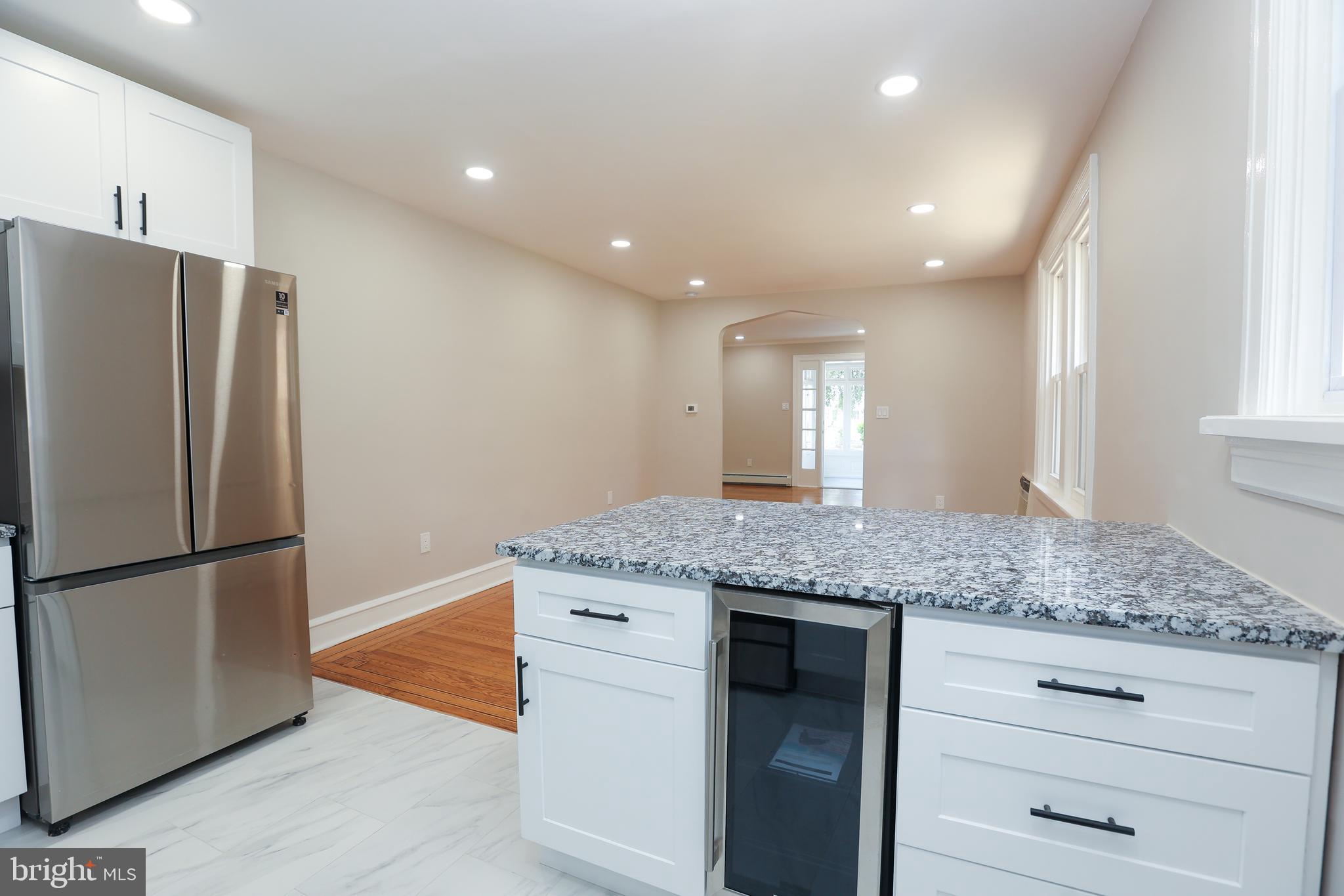 12 East Providence Road Lansdowne, PA 19050 - Photo 9 of 30 a kitchen with stainless steel appliances granite countertop cabinets and granite counter tops