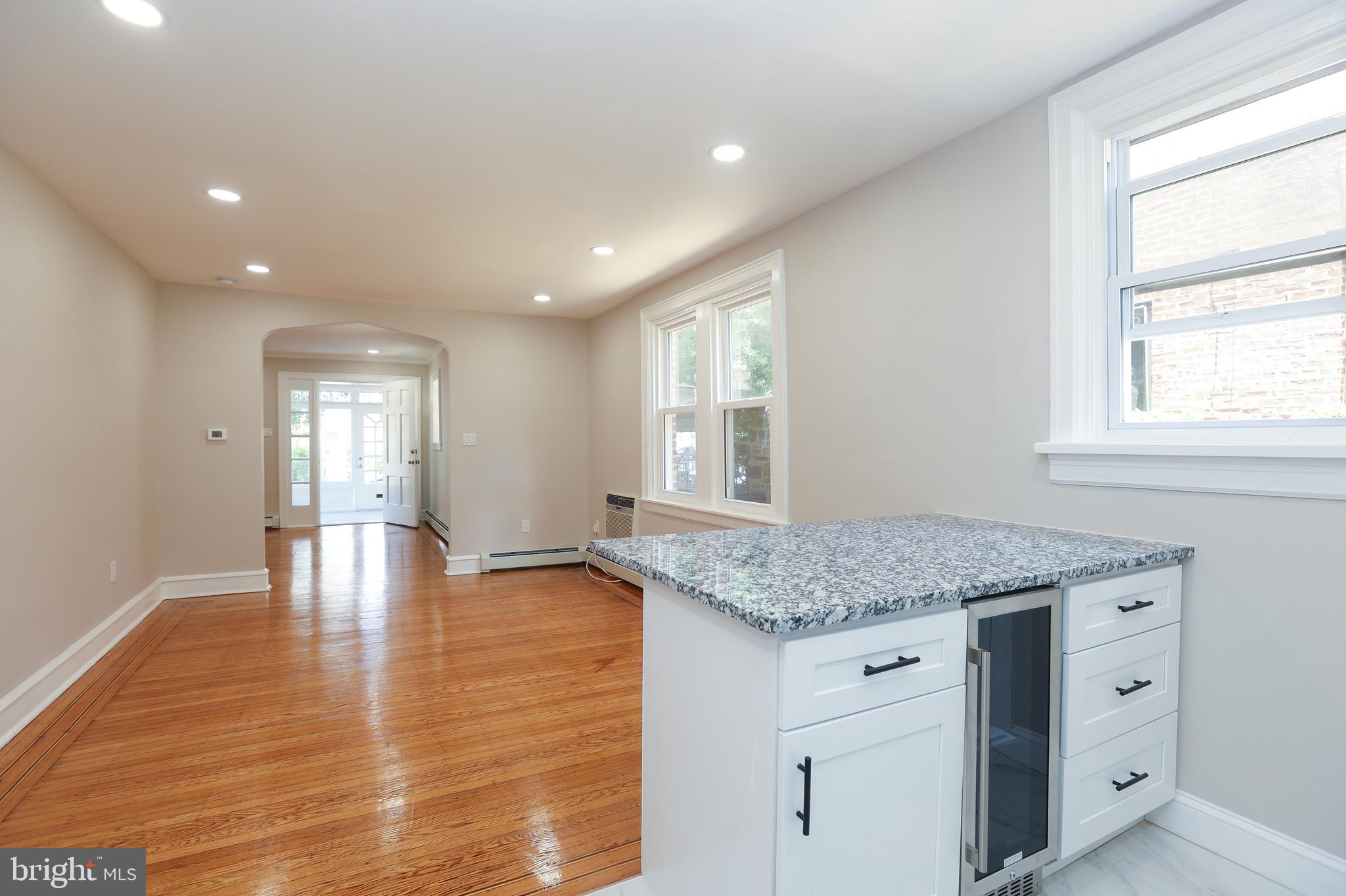 12 East Providence Road Lansdowne, PA 19050 - Photo 10 of 30 a kitchen with center island table and chairs