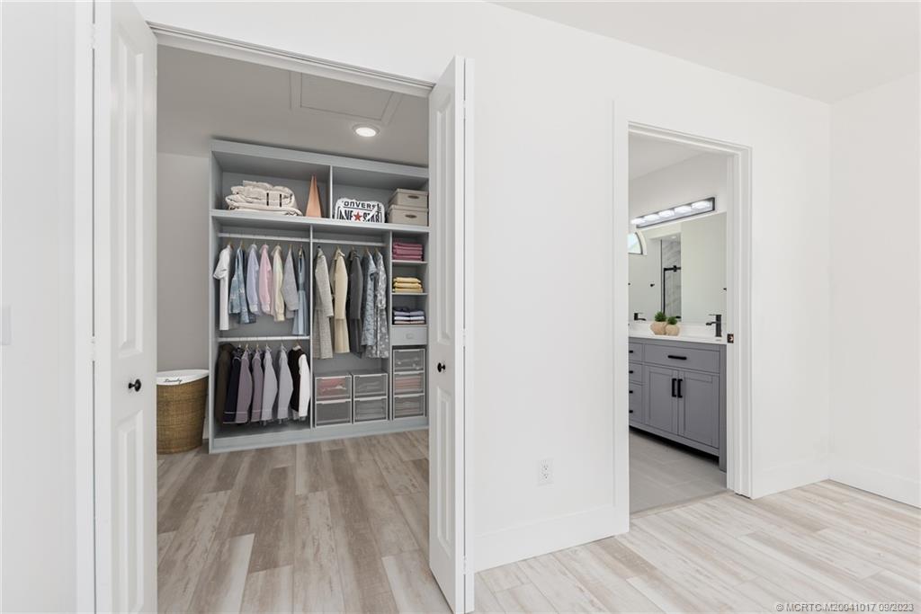 5008 Southeast Major Way Stuart, FL 34997 - Photo 11 of 20 wooden floor with a bathroom