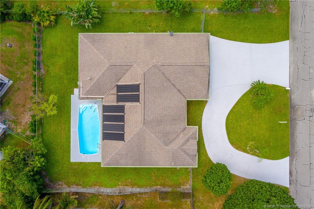5008 Southeast Major Way Stuart, FL 34997 - Photo 20 of 20 an aerial view of a house with a swimming pool