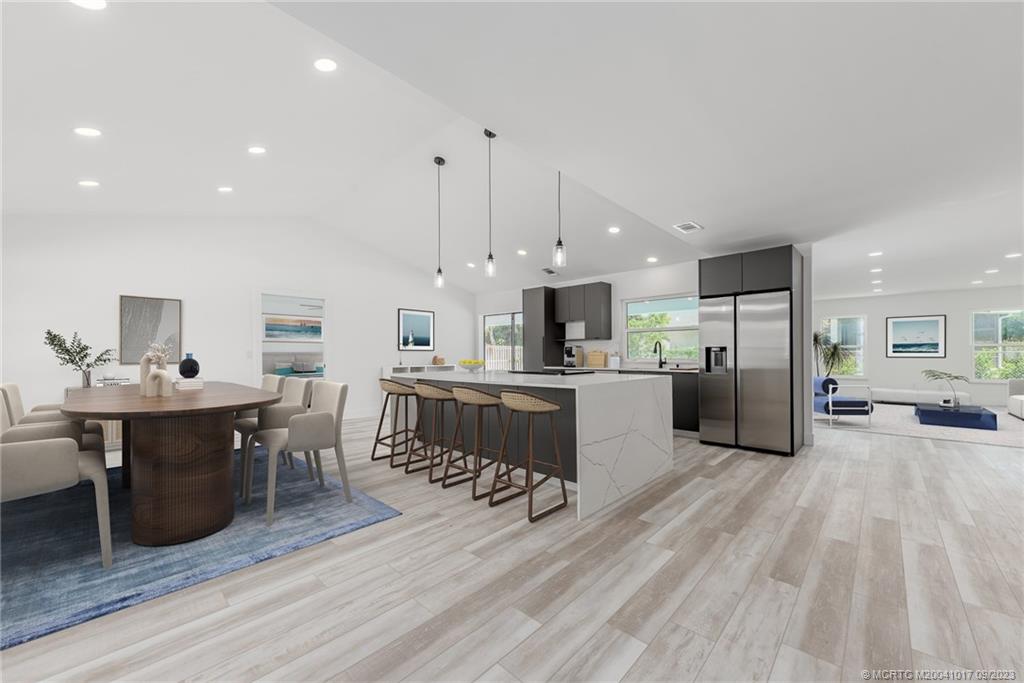 5008 Southeast Major Way Stuart, FL 34997 - Photo 5 of 20 a large kitchen with a table and chairs in it
