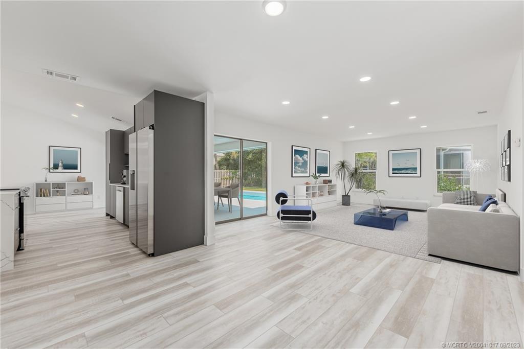 5008 Southeast Major Way Stuart, FL 34997 - Photo 7 of 20 a living room with furniture and a wooden floor