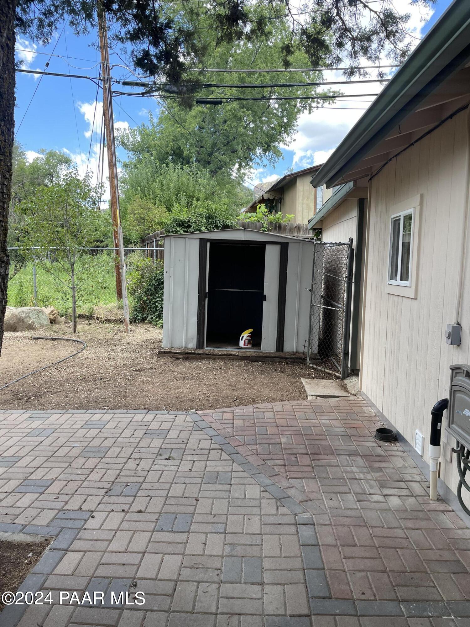 1803 Thumb Butte Road Prescott, AZ 86305 - Photo 31 of 42 Backyard pavers and shed
