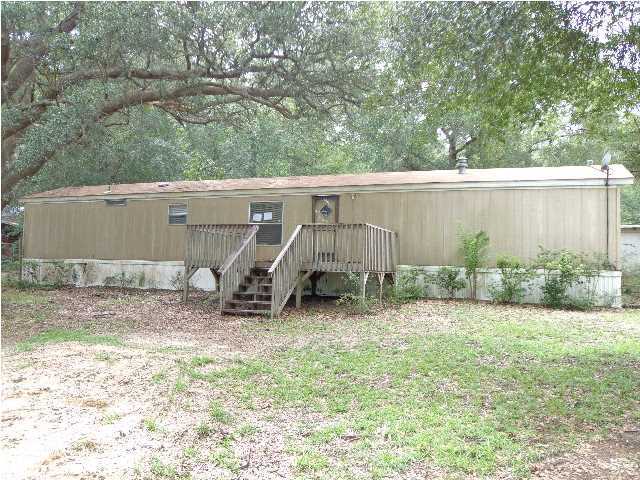 6120 Old River Road Baker, FL 32531 - Photo 1 of 7 a view of a backyard with a tree