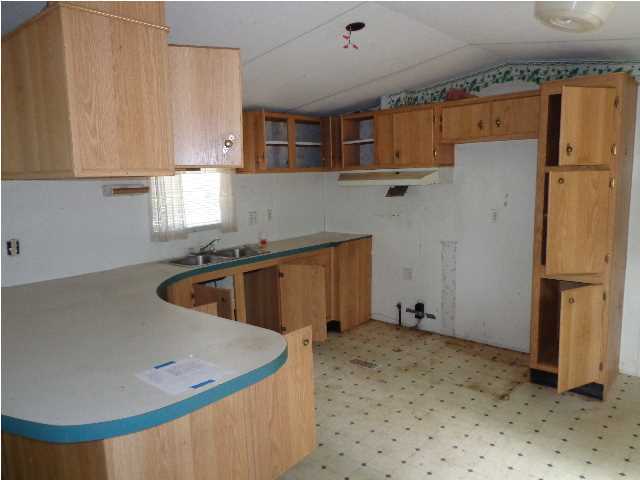 6120 Old River Road Baker, FL 32531 - Photo 6 of 7 a view of a kitchen with a sink and cabinets