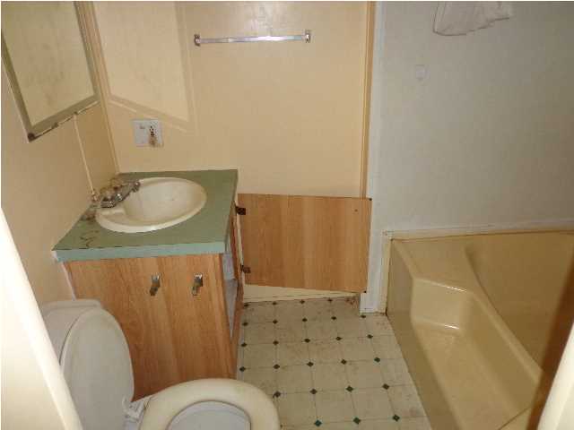 6120 Old River Road Baker, FL 32531 - Photo 7 of 7 a bathroom with a sink toilet and shower