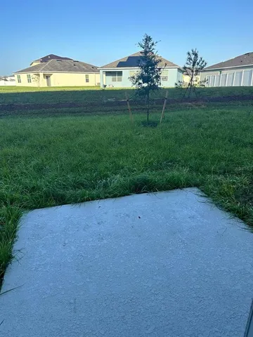a view of a golf course with a lake