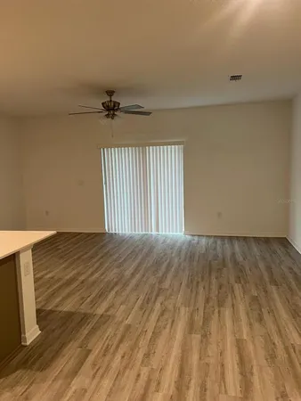 an empty room with wooden floor