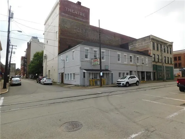 a view of a street with cars