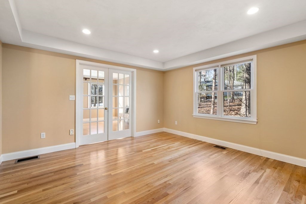 9 R Conant Street Acton, MA 01720 - Photo 14 of 42 a view of an empty room with wooden floor and a window