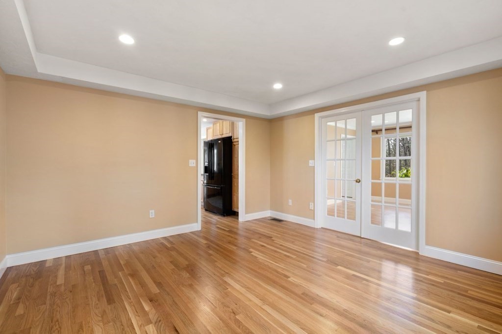 9 R Conant Street Acton, MA 01720 - Photo 15 of 42 a view of an empty room with wooden floor and a window