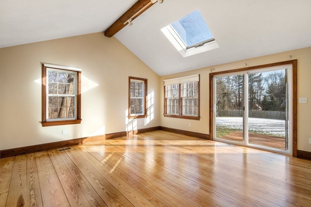 9 R Conant Street Acton, MA 01720 - Photo 19 of 42 a view of an empty room with wooden floor and a window